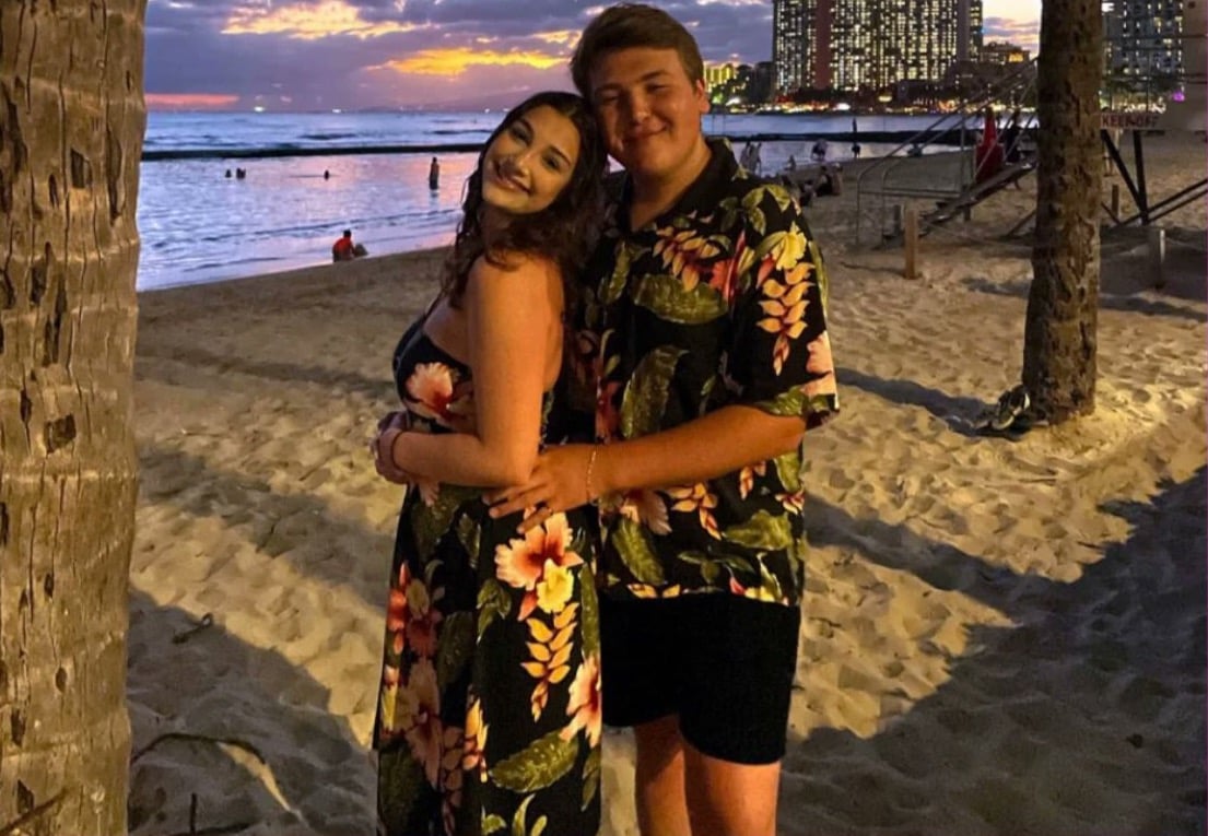 Gregory Ferraro and Leah Korenberg on the beach at sunset.