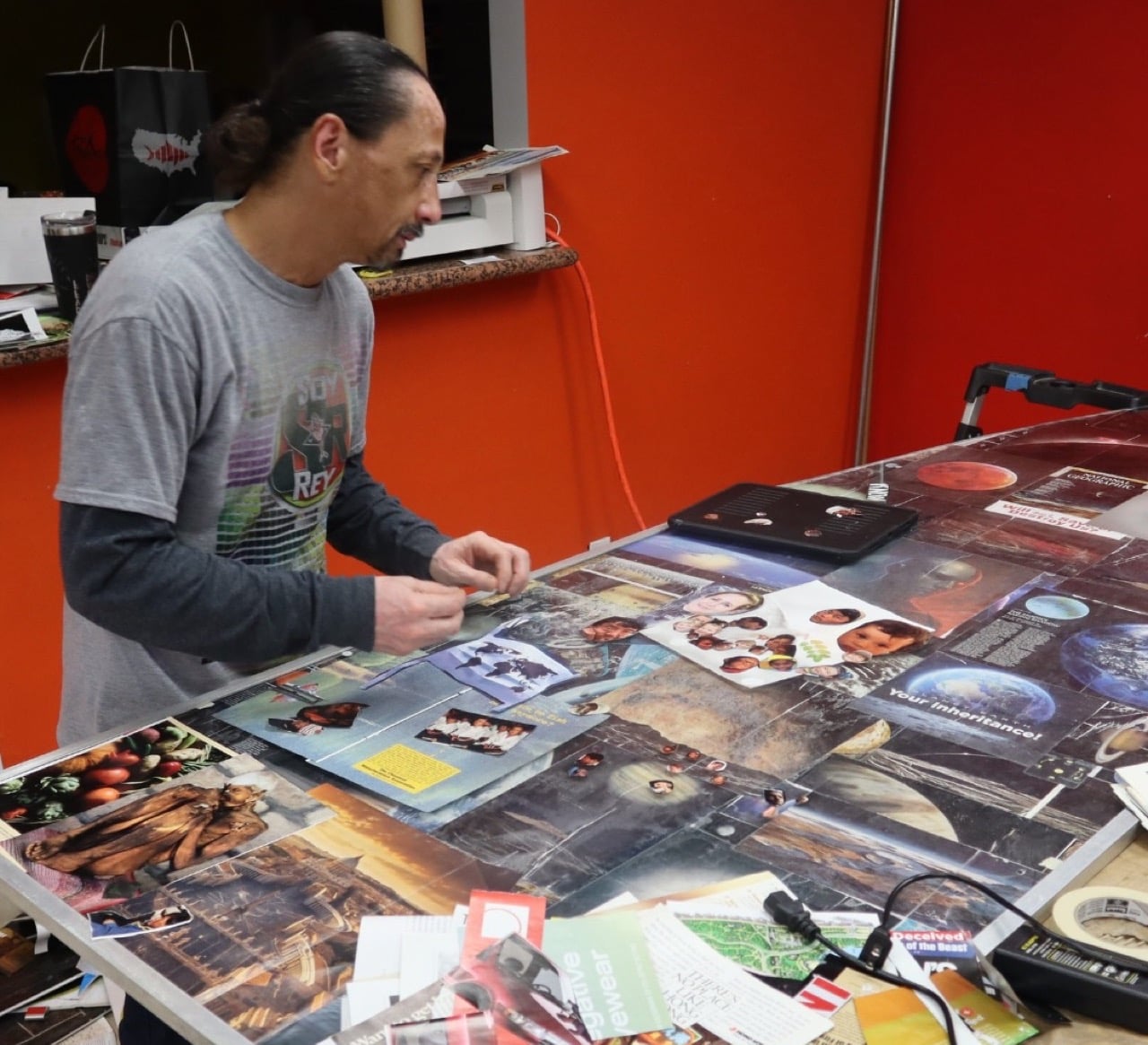 Antonio Palomo at work on a collage in his new artist space in Orange, California