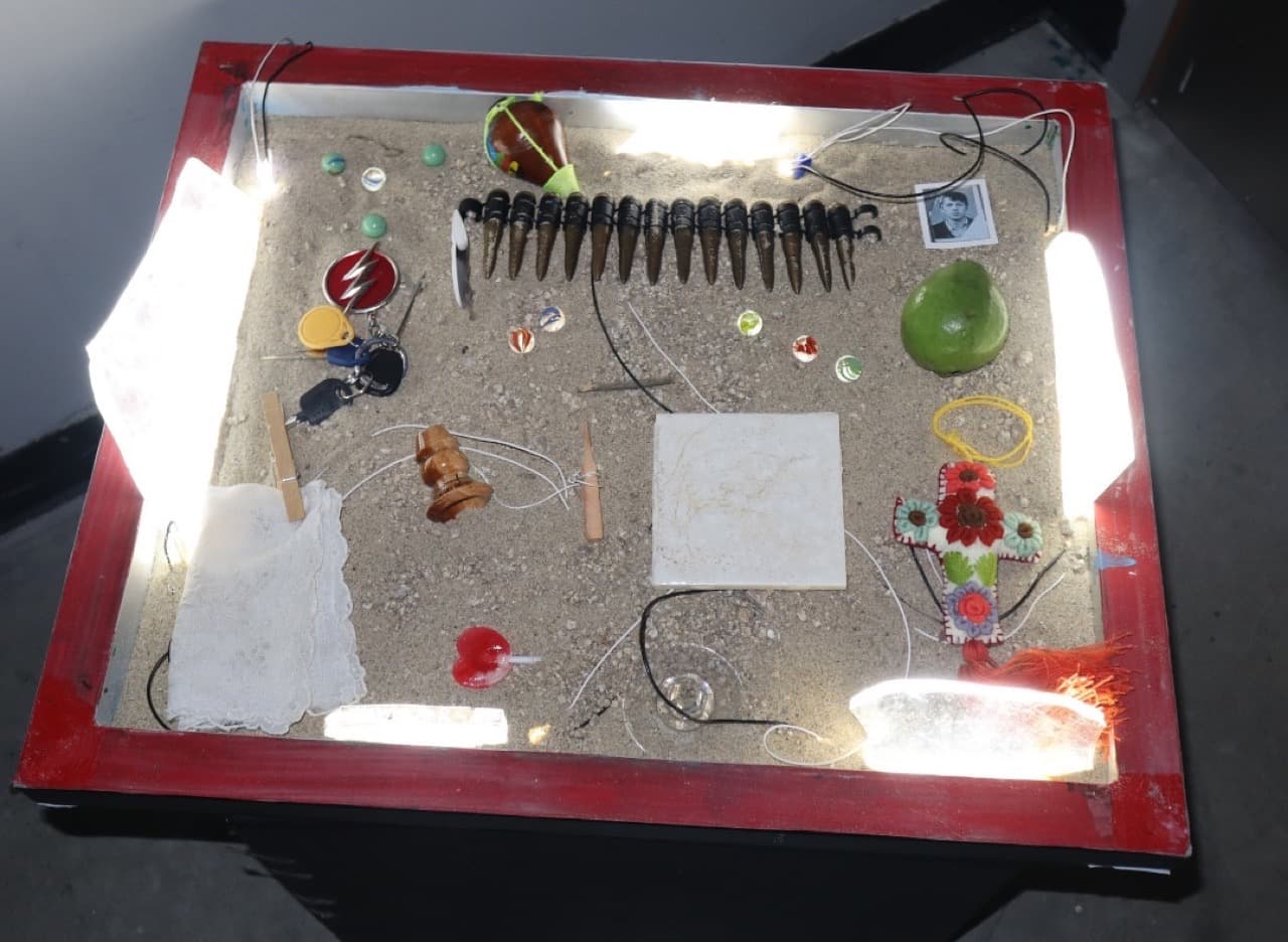 “The Treasure Box,” Antonio Palomo’s sandbox of childhood toys, debris and bullets