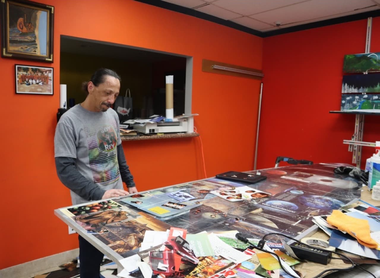 Antonio Palomo at the collage table in his artist space