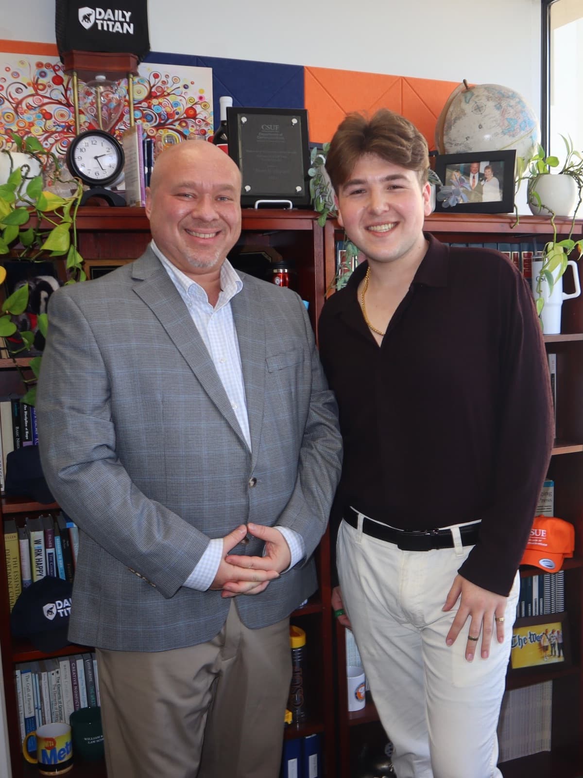 Gregory Ferraro with Dean Jason Shepard in the dean’s office. Courtesy of ProComm Magazine · 01