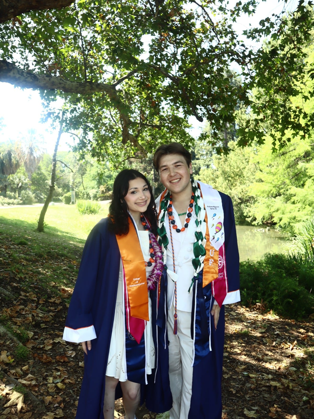Gregory Ferraro and Leah Korenberg in their caps and gowns after commencement, May 20, 2026.